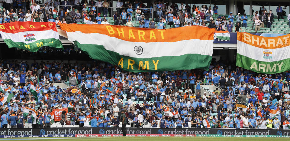 FILE- Indian national flags fly in the stands ahead of the ICC Champions Trophy match between India and South Africa in London, Sunday, June 11, 2017. Prime Minister Narendra Modi’s government has replaced India with the Sanskrit word 'Bharat' in dinner invitations sent for the Group of 20 summit, in a move that echoes with his Hindu nationalist party’s efforts to scrub away what it sees are colonial-era names. Politics over India versus Bharat has gained ground since the opposition parties in July announced a new alliance — called INDIA. (AP Photo/Kirsty Wigglesworth, File)