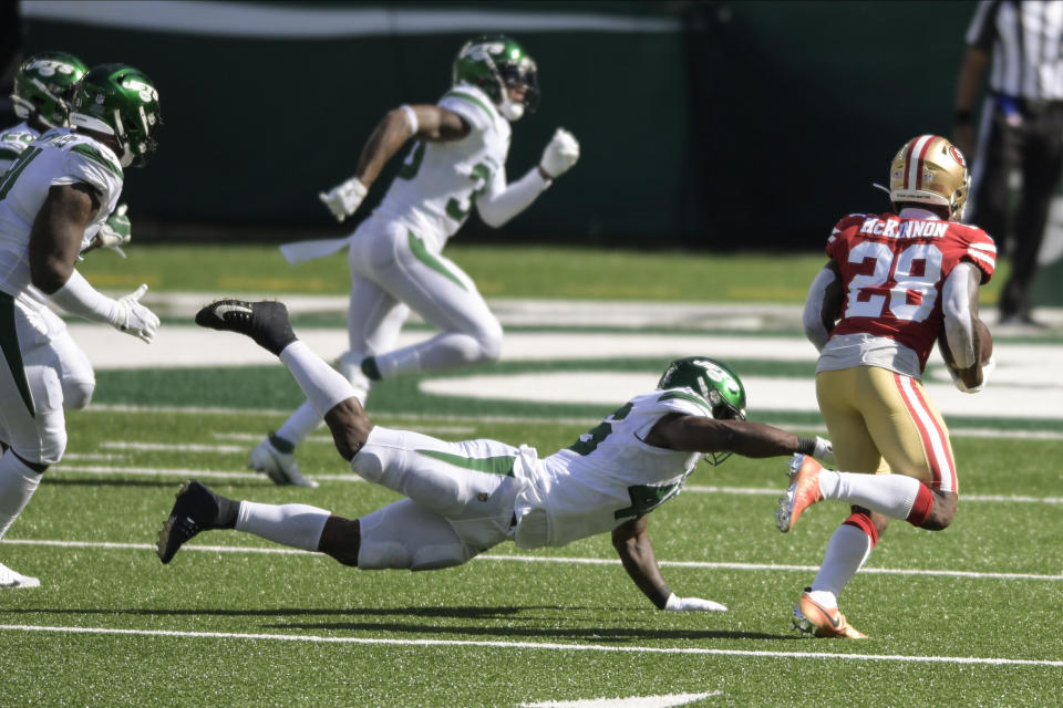 San Francisco 49ers running back Jerick McKinnon (28) runs past New York Jets' Neville Hewitt (46) for a touchdown during the second half of an NFL football game Sunday, Sept. 20, 2020, in East Rutherford, N.J. (AP Photo/Bill Kostroun)