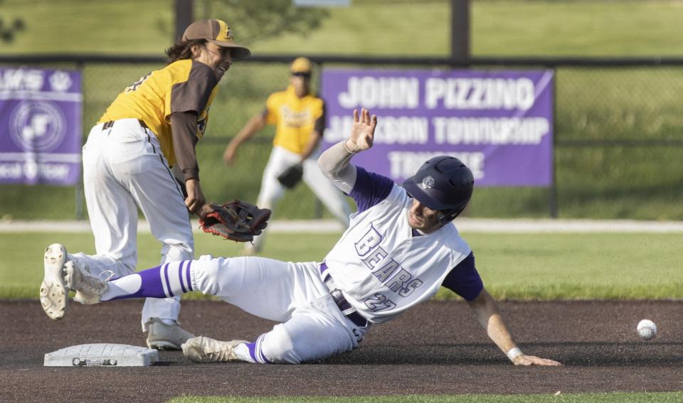 Jackson’s Garrett Wright steals second base in front of Brush’s Dylan Taylor in a Division I sectional final on Thursday, May 19, 2022.