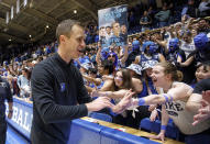 FILE - Duke head coach Jon Scheyer greets fans after defeating Wake Forest in an NCAA college basketball game in Durham, N.C., Tuesday, Jan. 31, 2023. Duke’s famously rowdy students spent weeks camping out and getting ready for Saturday’s annual rivalry game with North Carolina. And everyone from successor Jon Scheyer to the “Cameron Crazies" remain determined to preserve the fearsome homecourt advantage that is part of former coach Mike Krzyzewski’s unparalleled legacy.(AP Photo/Ben McKeown, File)