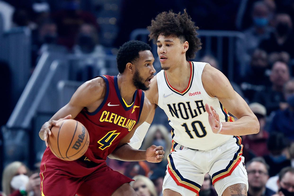 Cleveland Cavaliers' Evan Mobley (4) drives against New Orleans Pelicans' Jaxson Hayes (10) during the first half of an NBA basketball game, Monday, Jan. 31, 2022, in Cleveland. (AP Photo/Ron Schwane)