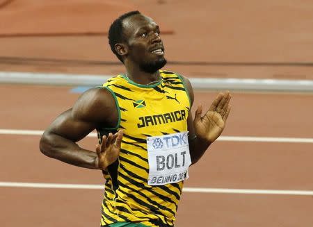 Usain Bolt of Jamaica reacts after winning the men's 200 metres final during the 15th IAAF World Championships at the National Stadium in Beijing, China, August 27, 2015. REUTERS/Fabrizio Bensch