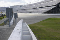 FILE - NASCAR SAFER barriers are viewed in Turn 4 during qualifying for a NASCAR truck series auto race at Daytona International Speedway, Friday, Feb. 17, 2023, in Daytona Beach, Fla. Head-and-neck restraints and SAFER barriers. The two advancements rank as the most significant in NASCAR history. (AP Photo/Phelan M. Ebenhack, File)