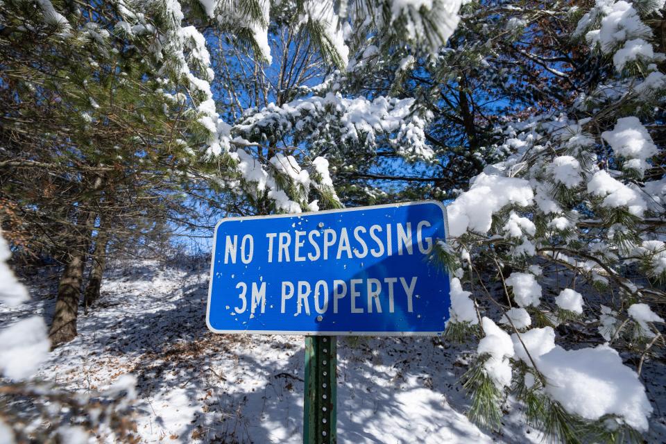 A sign marks the border between Menomin Park and 3M’s plant on Friday, February 16, 2024, in Menomonie, Wisconsin. Groundwater near the 3M plant on the edge of the Dunn County city has tested positive for PFAS, although none has been found in municipal wells.