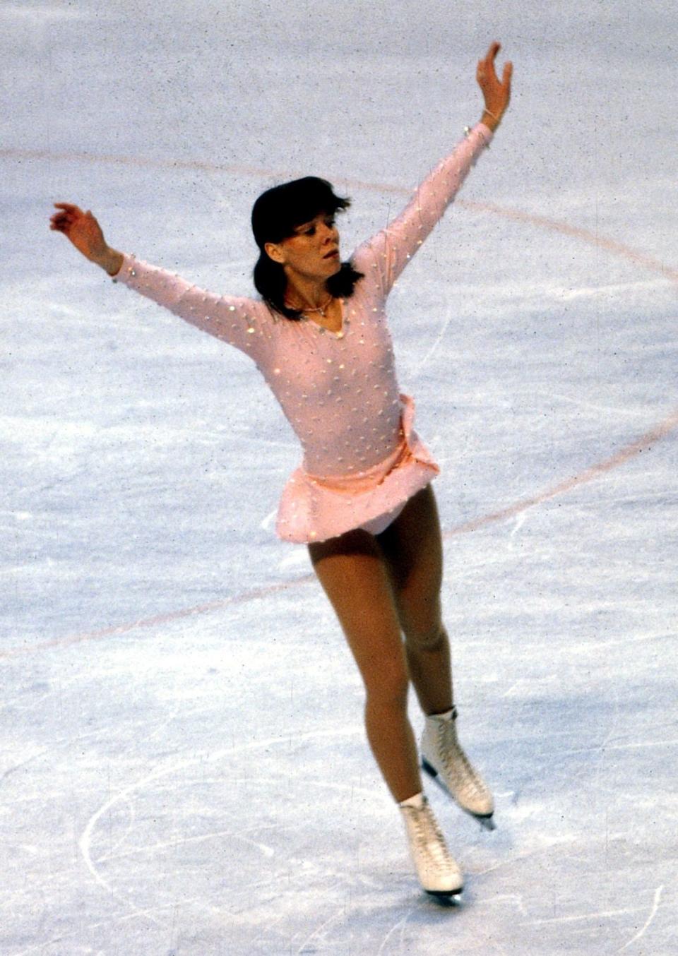 The West German skater performing at the 1980 Winter Olympics in Lake Placid, New York.