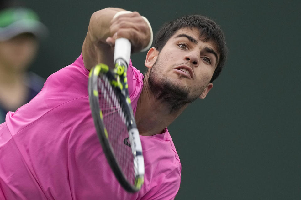 Carlos Alcaraz, of Spain, serves to Daniil Medvedev, of Russia, during the men's singles final at the BNP Paribas Open tennis tournament Sunday, March 19, 2023, in Indian Wells, Calif. (AP Photo/Mark J. Terrill)