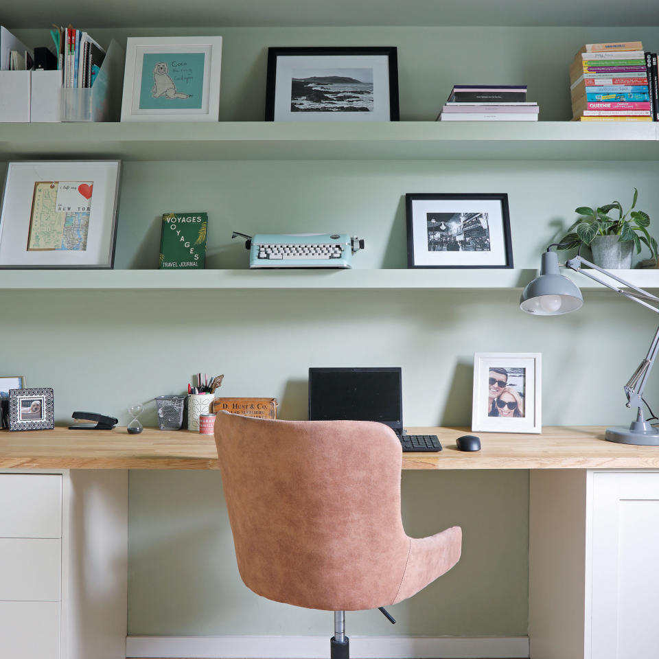 Study area with built-in desk and floating open shelves