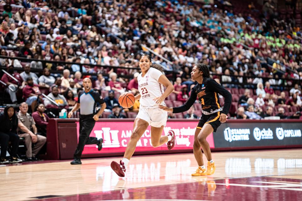 Florida State women's basketball forward Erin Howard dribbles the ball in a win over Bethune-Cookman.
