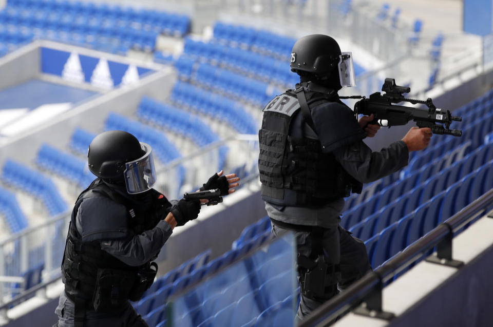 Members of the National Gendarmerie Intervention Group (GIGN), Recherche Assistance Intervention Dissuasion (RAID) and Research and Intervention Brigades (BRI) attend a training exercise in case of terrorist attack at the G6 Interior Ministers' meeting at the Groupama stadium in Decines, near Lyon, central France, Tuesday, Oct. 9, 2018. (AP Photo/Christophe Ena)