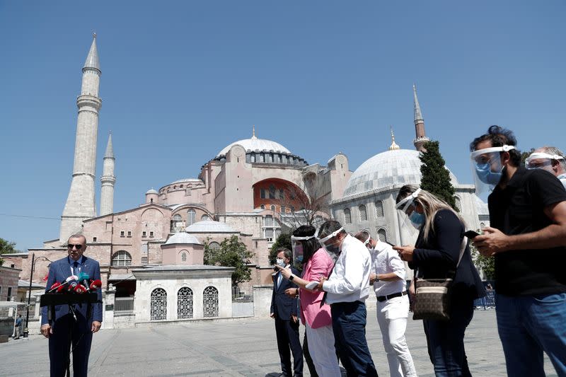 FILE PHOTO: Turkish President Tayyip Erdogan talks to media after attending Friday prayers at Hagia Sophia Grand Mosque, in Istanbul
