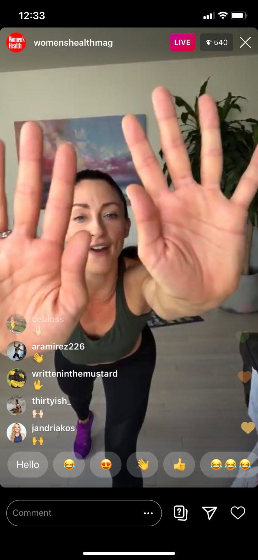 Trainer Kara Liotta gives virtual high fives during an Instagram Live workout on the @womenshealthmag page.