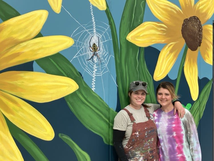 Dawn, left, and her mural assistant Pauline Hernstrom, who helped on the Y project in downtown Rock Island.