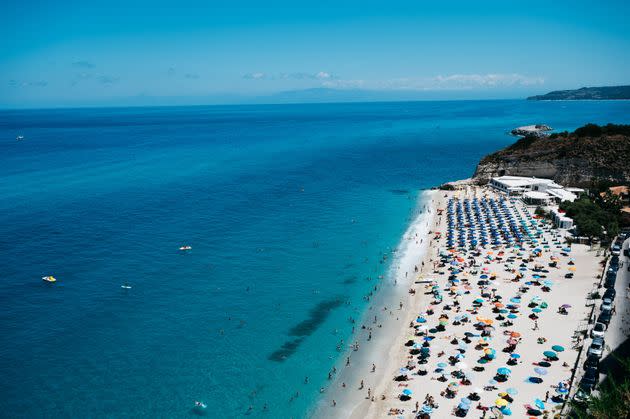 TROPEA, ITALY - 2021/07/12: Panoramic view of public beaches and 