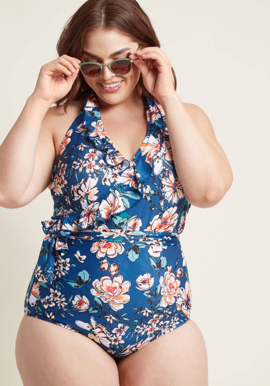Get it at <strong><a href="https://www.modcloth.com/shop/swimwear/here-comes-ruffle-one-piece-swimsuit-in-botanical-navy/152196.html" target="_blank" rel="noopener noreferrer">Modcloth</a></strong>, $85.