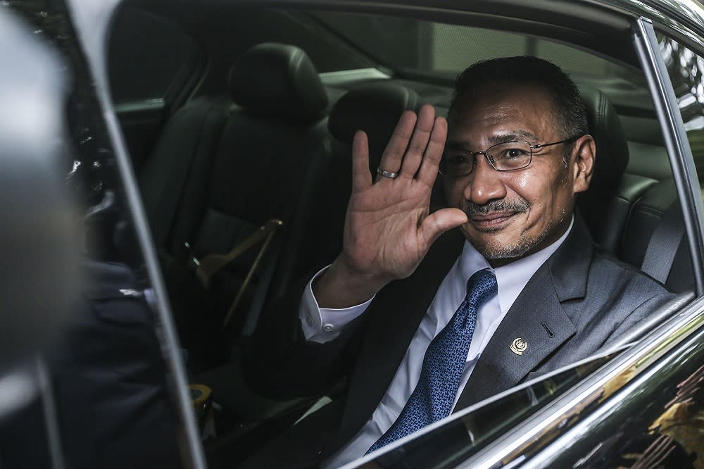 Foreign Minister Datuk Seri Hishammuddin Hussein waves at the press as he arrives at the Prime Minister’s Office in Putrajaya October 23, 2020. — Picture by Hari Anggara