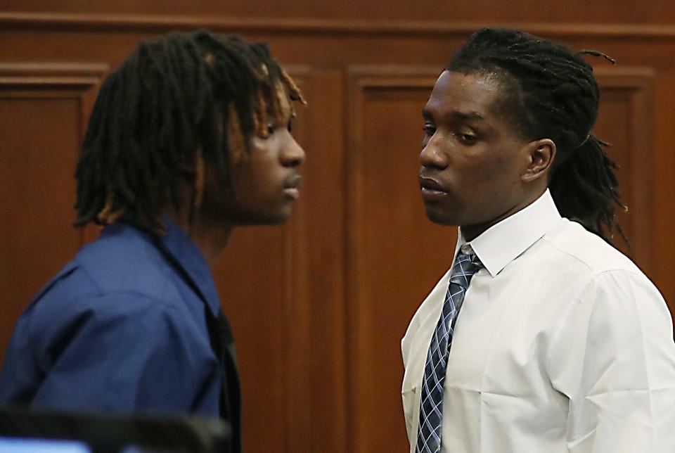 Brothers Tyler and DeShawn Stafford stand during a break in their trial in the death of Ethan Liming in Summit County Common Pleas Judge Tammy O'Brien's courtroom.