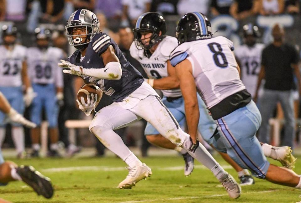 Clovis East’s Harold Duvall takes the ball into the secondary after a catch against Clovis North during their TRAC opener at Lamonica Stadium on Friday, Sept. 29, 2023. CRAIG KOHLRUSS/ckohlruss@fresnobee.com
