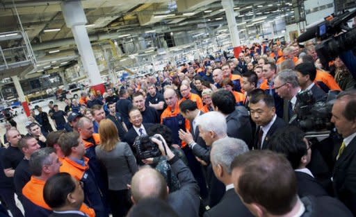 Chinese Prime Minister Wen Jiabao (C), is surrounded by Volvo employees and media during his visit to the Volvo car factory in Gothenburg. Chinese automaker Geely bought Volvo Cars from US carmaker Ford in 2010