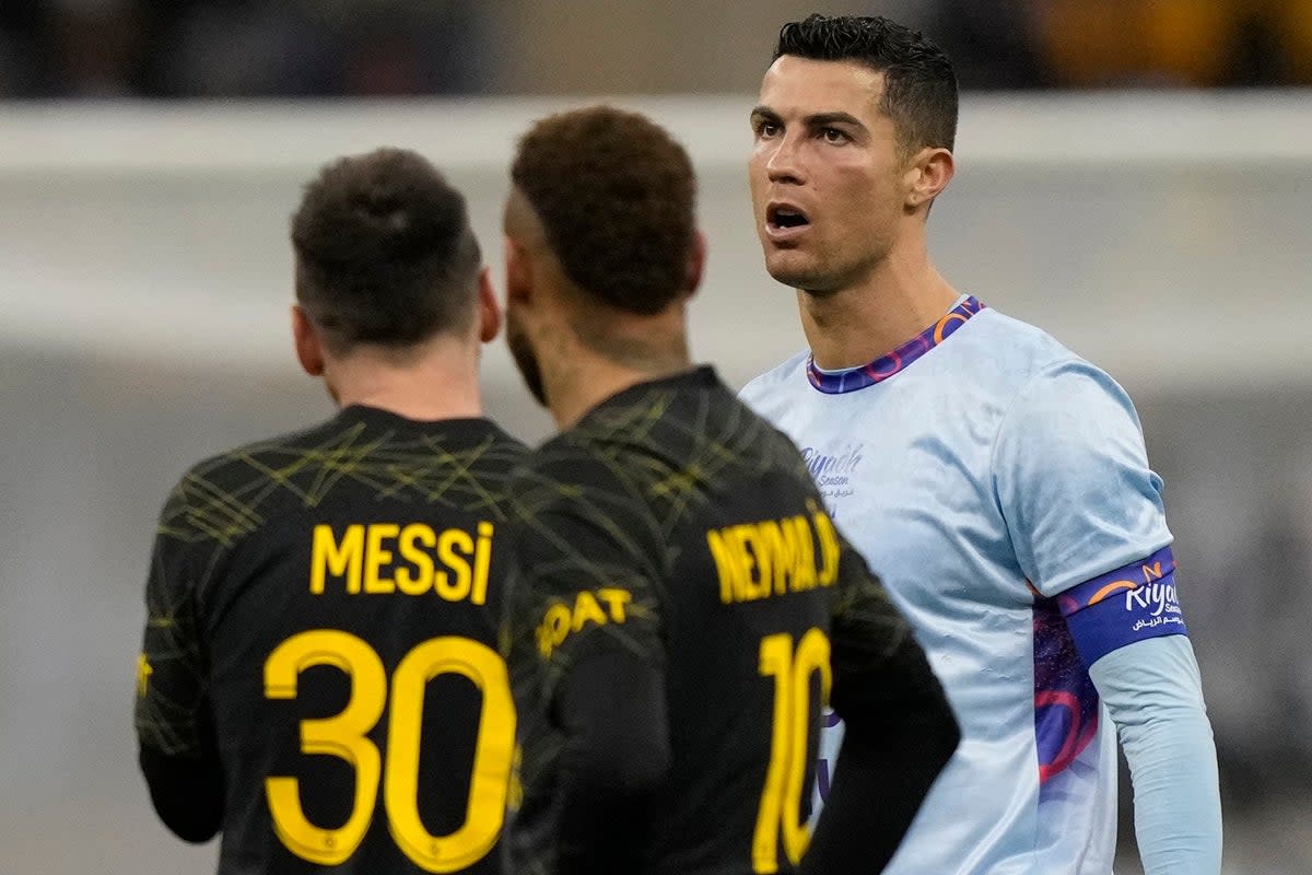 Cristiano Ronaldo (right) scored twice on his first appearance in Saudi Arabia with Lionel Messi (left) also on target (Hussein Malla/AP) (AP)