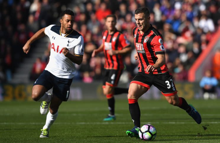 Dembele and Wilshere of Bournemouth compete in midfield