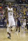 Indiana Pacers' Paul George (24) reacts after hitting a three-point shot at the end of the third quarter during Game 2 of an opening-round NBA basketball playoff series against the Atlanta Hawks Tuesday, April 22, 2014, in Indianapolis. Indiana defeated Atlanta 101-85. (AP Photo/Darron Cummings)