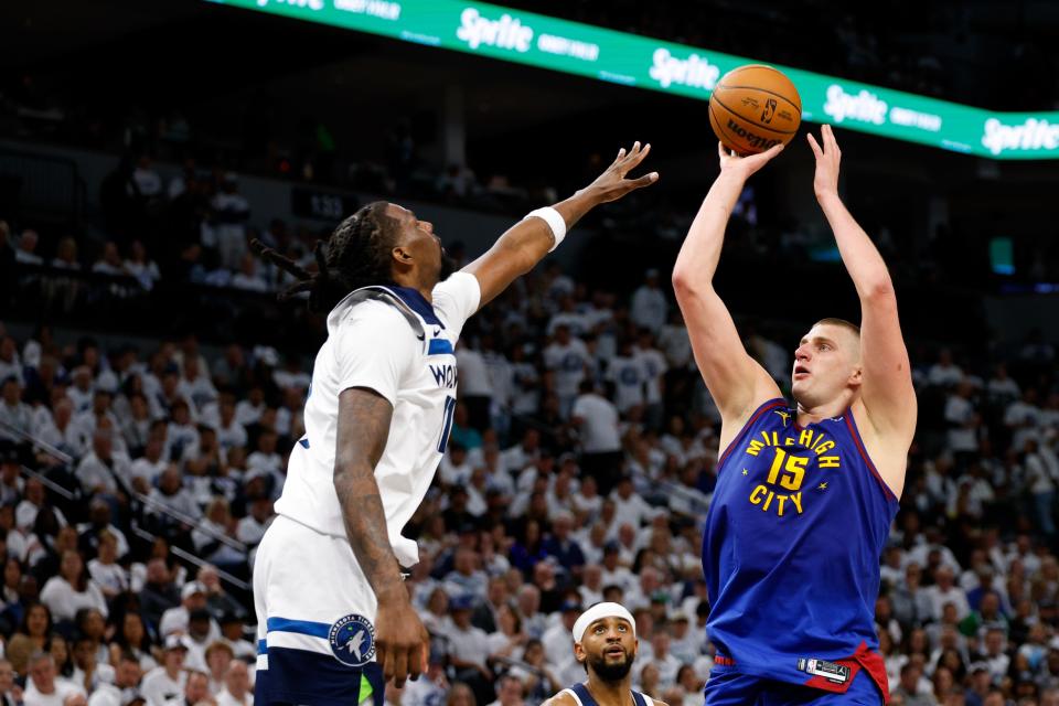 MINNEAPOLIS, MINNESOTA - MAY 10: Nikola Jokic #15 of the Denver Nuggets shoots the ball against Naz Reid #11 of the Minnesota Timberwolves during the second quarter in Game Three of the Western Conference Second Round Playoffs at Target Center on May 10, 2024 in Minneapolis, Minnesota. NOTE TO USER: User expressly acknowledges and agrees that, by downloading and or using this photograph, User is consenting to the terms and conditions of the Getty Images License Agreement. (Photo by David Berding/Getty Images)