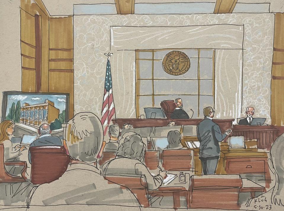 In this courtroom sketch, prosecuting attorney Eric G. Olshan questions witness Rabbi Jeffrey Myers of the Tree of Life Congregation, in the federal trial for 2018 synagogue massacre suspect Robert Bowers, on Tuesday, May 30, 2023, in Pittsburgh. Bowers could face the death penalty if convicted of some of the 63 counts he faces in the shootings, which claimed the lives of worshippers from three congregations who were sharing the building, Dor Hadash, New Light and Tree of Life. (David Klug via AP)