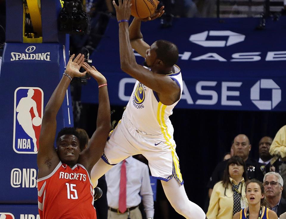 Clint Capela and Kevin Durant are turning up the heat on a budding rivalry. (AP)