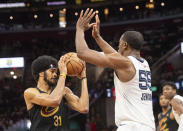 Memphis Grizzlies' Trey Jemison (55) blocks the path of Cleveland Cavaliers' Jarrett Allen (31) during the first half of an NBA basketball game in Cleveland, Wednesday, April 10, 2024. (AP Photo/Phil Long)