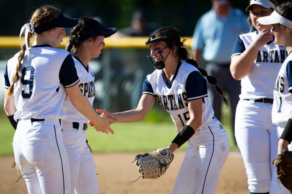 Marist’s Malia Williams, center, celebrates with teammates as the Spartans defeated Stayton 6-0 at Marist Catholic High School in Eugene Tuesday, May 31, 2022. 