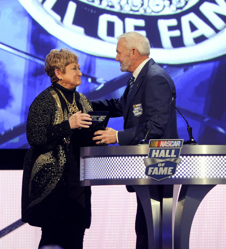 Former NASCAR driver Dale Jarrett, right, talks to Terri Parsons, wife of the late Benny Parsons, during the NASCAR Hall of Fame induction ceremony in Charlotte, N.C., Friday, Jan. 20, 2017. (AP Photo/Mike McCarn)