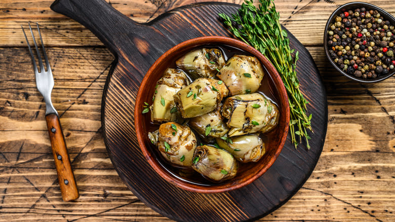 marinated artichokes on a board