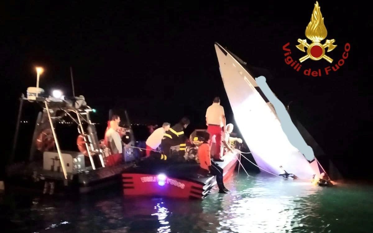 Rescue workers around the speed boat which crashed near Venice - via REUTERS