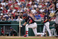 Washington Nationals' Lane Thomas reacts after striking out during the fifth inning of the team's baseball game against the Miami Marlins at Nationals Park, Friday, July 1, 2022, in Washington. (AP Photo/Alex Brandon)