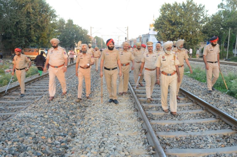 Indian police are investigating how a speeding train ploughed into a crowd of revellers, killing around 60 and injuring dozens more