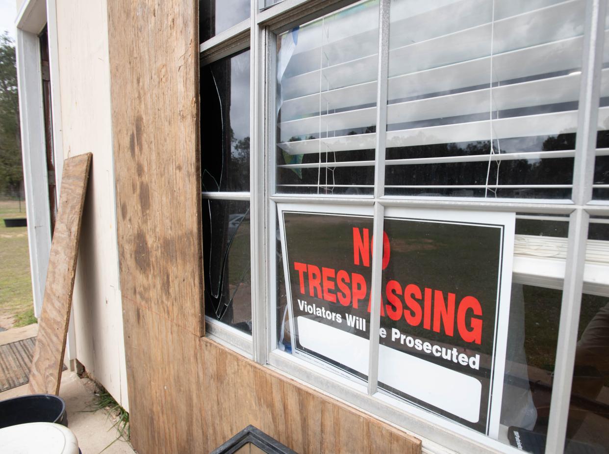 No Trespassing signs are posted on the property owned by Carrie Black-Phillips and her family on Tom Sawyer Road in Milton on Tuesday, Feb. 27, 2024. The family is trying to clean up the mess left by the squatters and are battling to keep them off the property.