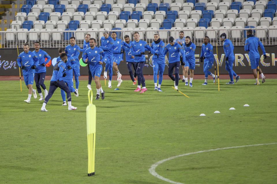 Israel's national team warm up during a training session for the Euro 2024 group I qualifying soccer match between Kosovo and Israel at the Fadil Vokrri stadium in Pristina, Kosovo, Saturday, Nov. 11, 2023. (AP Photo/Visar Kryeziu)