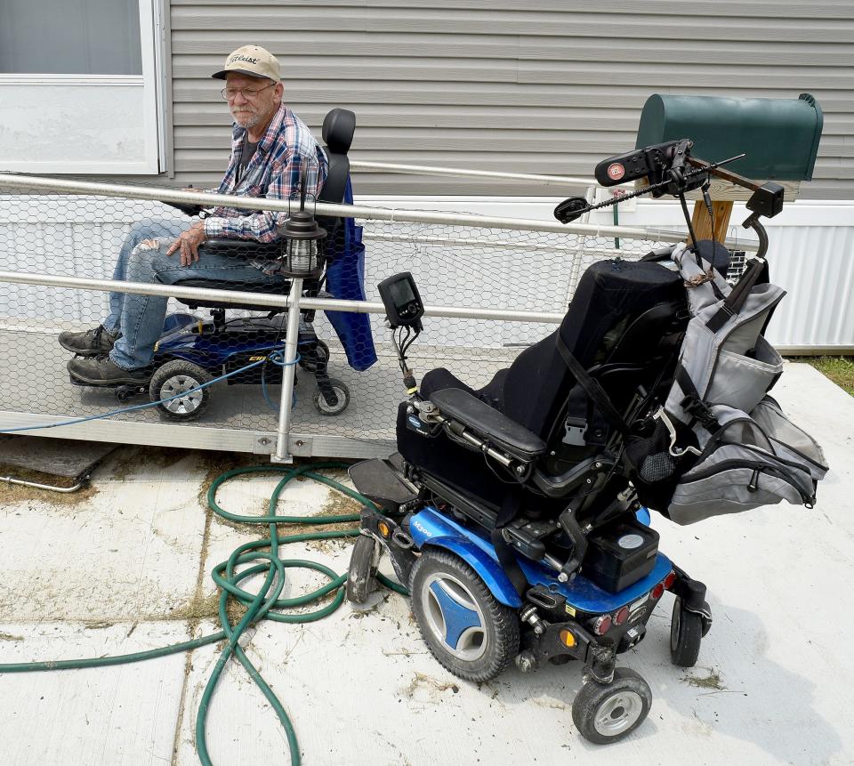Army veteran Kenneth Clelland drives up the ramp to his mobile home in Carleton with the wheelchair that was loaned to him by Binson’s Medical Equipment & Supplies in Macomb County. The other wheelchair had an electrical fire and needed to be replaced.