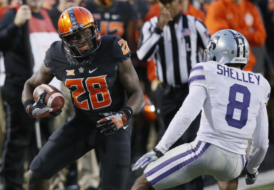 Oklahoma State’s James Washington averages over 20 yards a catch. (AP Photo/Sue Ogrocki, File)