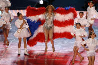 Singer Jennifer Lopez and her daughter Emme Maribel Muñiz perform while a Puerto Rican flag is displayed on stage during the Pepsi Super Bowl LIV Halftime Show at Hard Rock Stadium on February 02, 2020 in Miami, Florida. (Photo by Elsa/Getty Images)