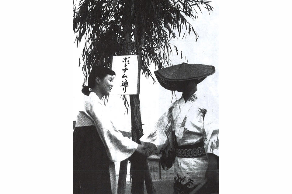 In this reproduction of undated photo, Korean and Japanese students shake their hands in front of willow trees in Niigata, Japan. About 300 willow trees were planted in the celebration of a resettlement program led by North Korea under the name of Japan and Korea friendship in 1959. (Harunori Kojima via AP)