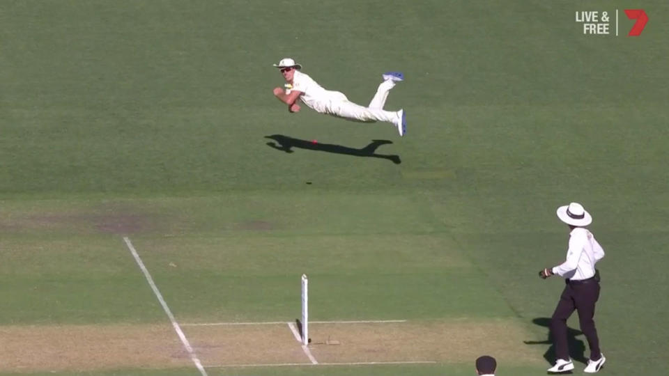 Pat Cummins’ diving effort stunned India’s century-making batsman. Pic: Channel 7