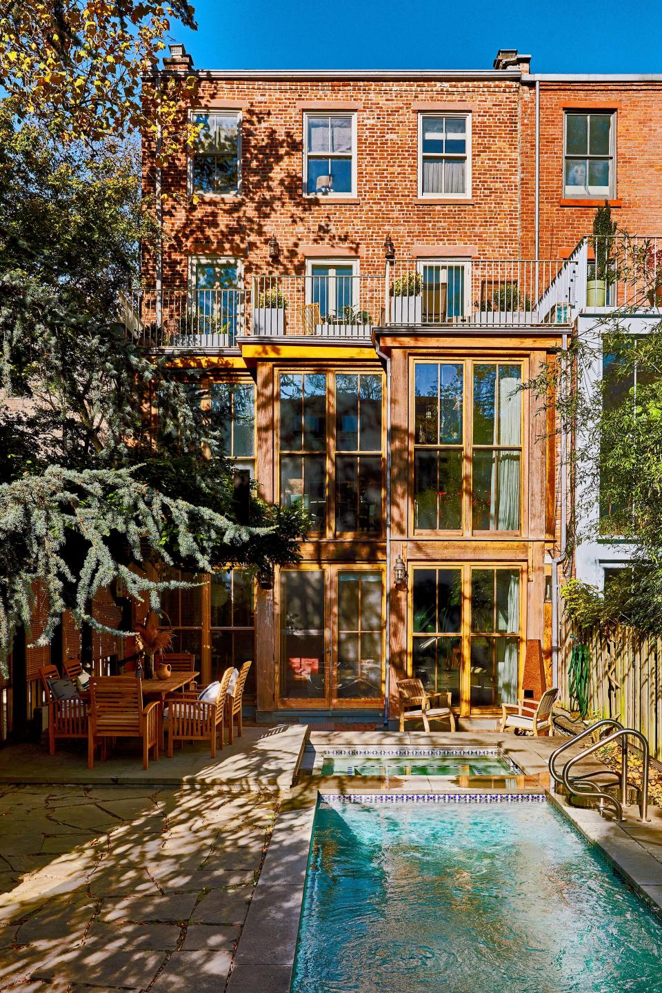 The backyard features a heated lap pool.