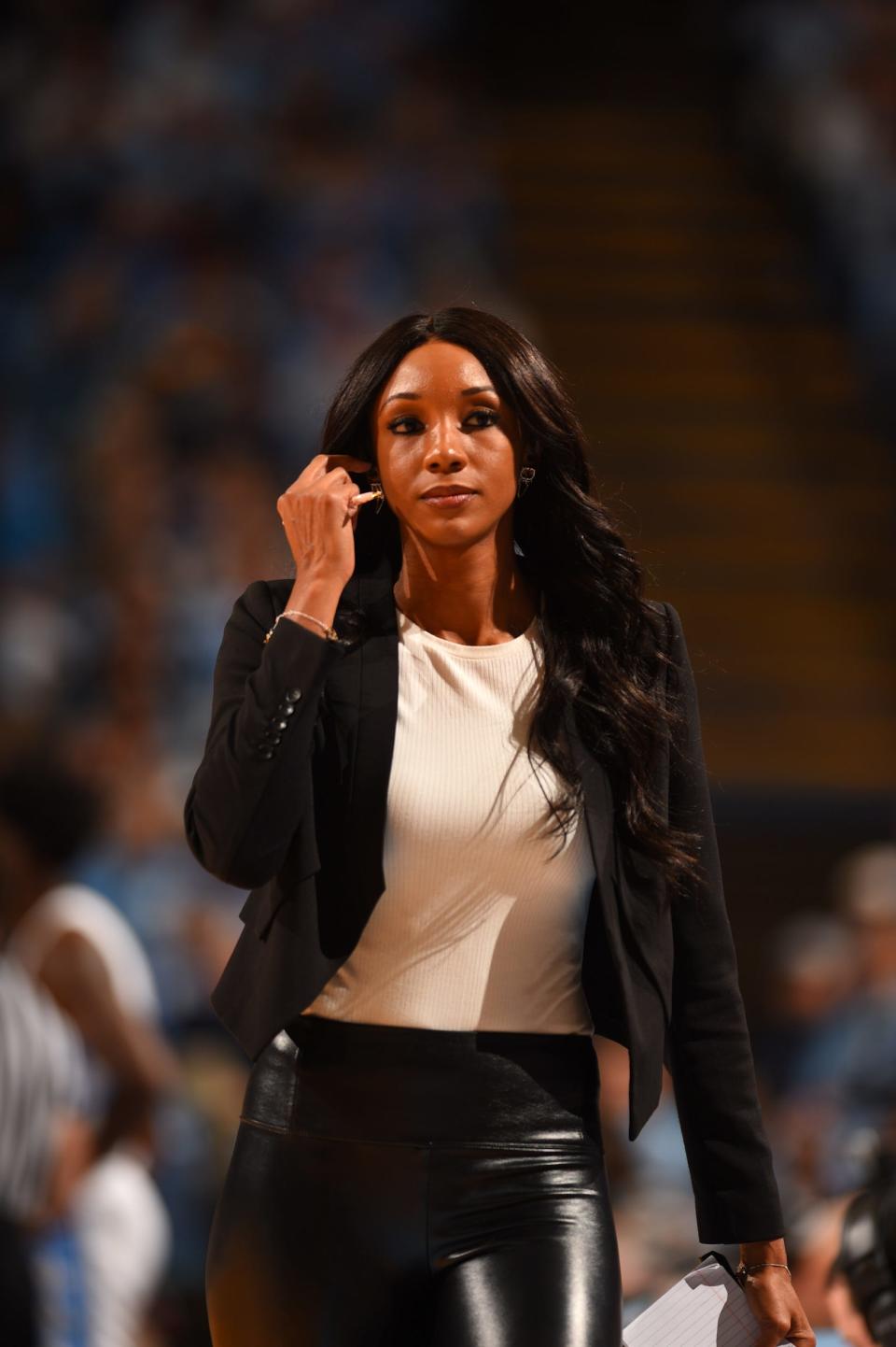 ESPN's Maria Taylor reports from courtside at the Dean E. Smith Center in Chapel Hill, N.C., in 2019.