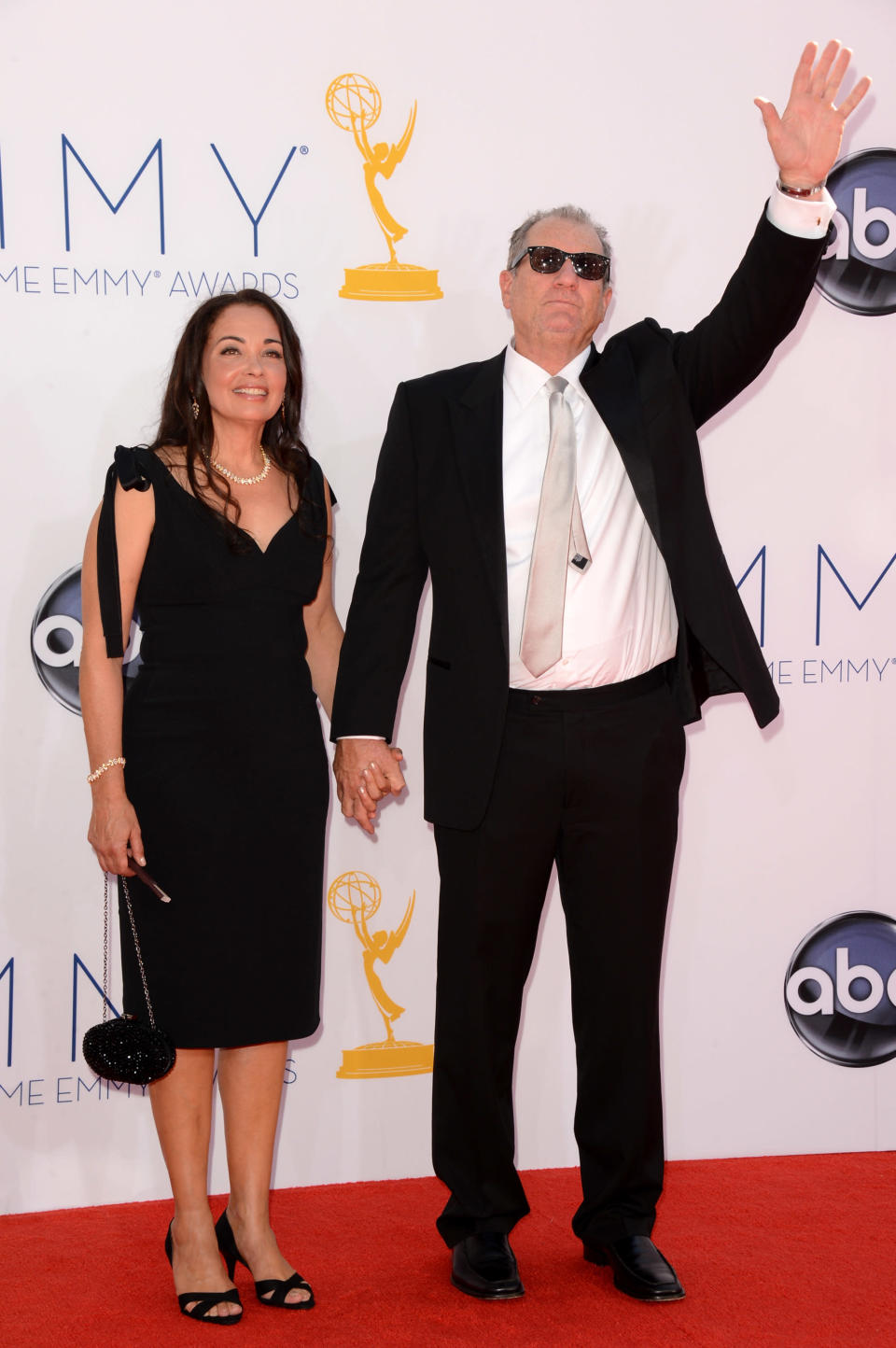 Ed O'Neill and guest arrive at the 64th Primetime Emmy Awards at the Nokia Theatre in Los Angeles on September 23, 2012.