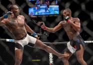 Apr 23, 2016; Las Vegas, NV, USA; Jon Jones (red gloves) competes against Ovince Saint Preux (blue gloves) during UFC 197 at MGM Grand Garden Arena. Mandatory Credit: Joshua Dahl-USA TODAY Sports