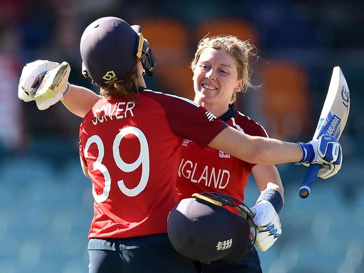 England's Heather Knight celebrates reaching her century: AFP via Getty Images