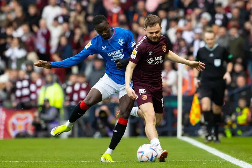 Hearts star Alan Forrest goes up against Mohamed Diomande at Hampden