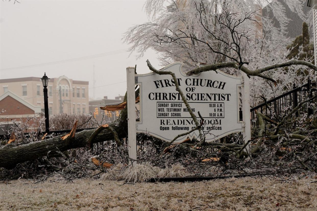 The outdoor sign at the First Church of Christ Scientist in Adrian, 229 Dennis St., was the landing spot for this tree branch Thursday, Feb. 23, 2023, the result of a freezing rain and ice storm that rolled through Lenawee County nearly the entire day Wednesday.