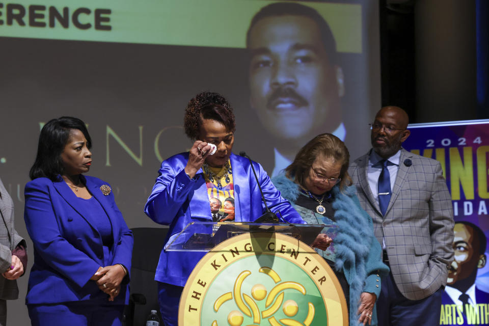 Bernice King, center, gets emotional as she speaks during a news conference on the passing of her brother, Dexter Scott King, son of Dr. Martin Luther King, Jr. at the Yolanda D. King Theatre for the Performing Arts, Tuesday, Jan. 23, 2024 in Atlanta. Also pictured is Angela Farris Watkins, left, Alveda King, second from right, and King Estate General Council Eric Tidwell, right. (Jason Getz/Atlanta Journal-Constitution via AP)